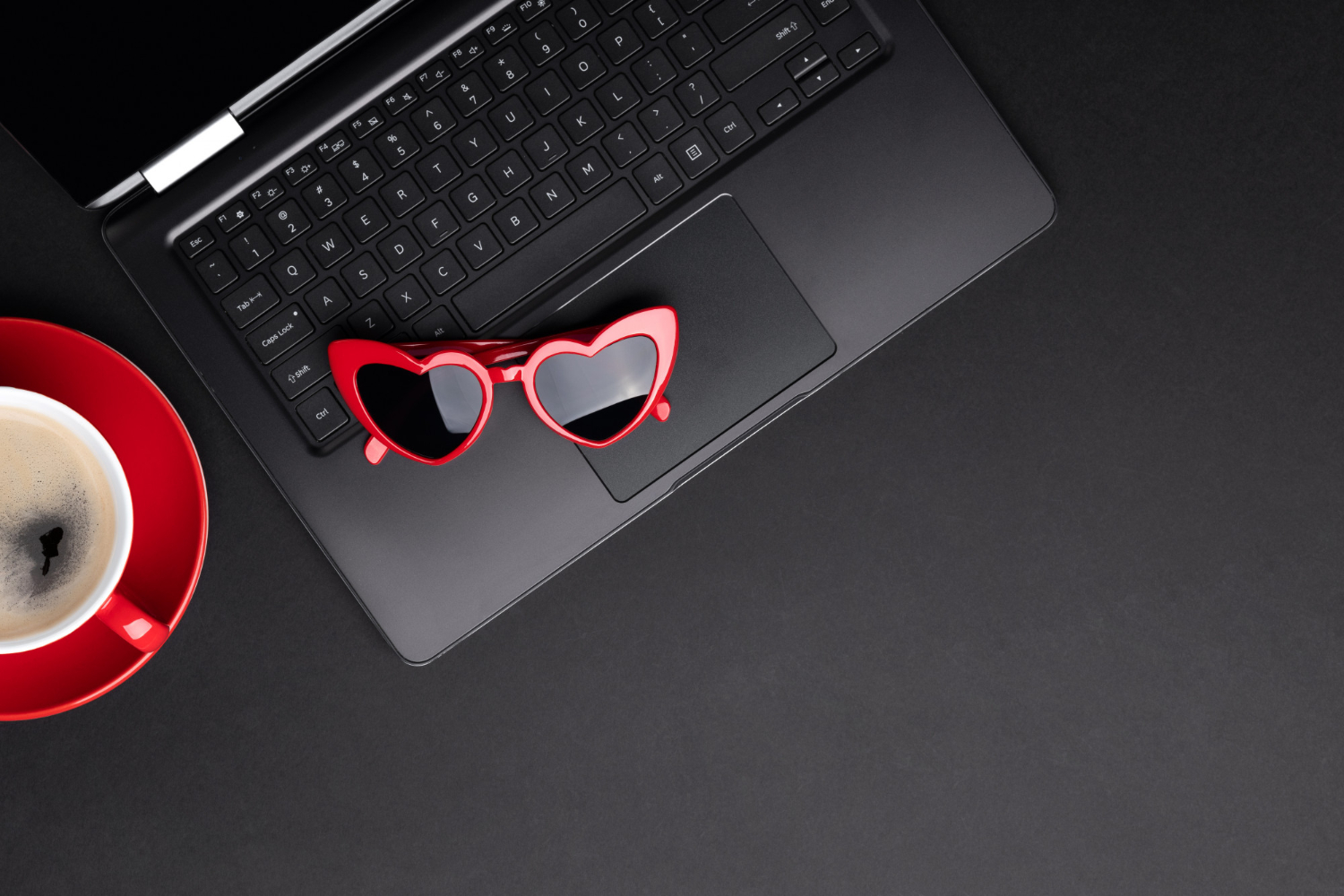 flat-lay-top-view-monochrome-composition-with-laptop-cup-of-coffee-and-sunglasses