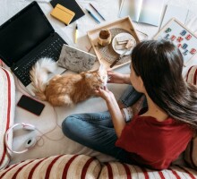 freelancer-young-woman-working-in-home-office-with-laptop-computer-and-cat-remote-online-working-1024x683